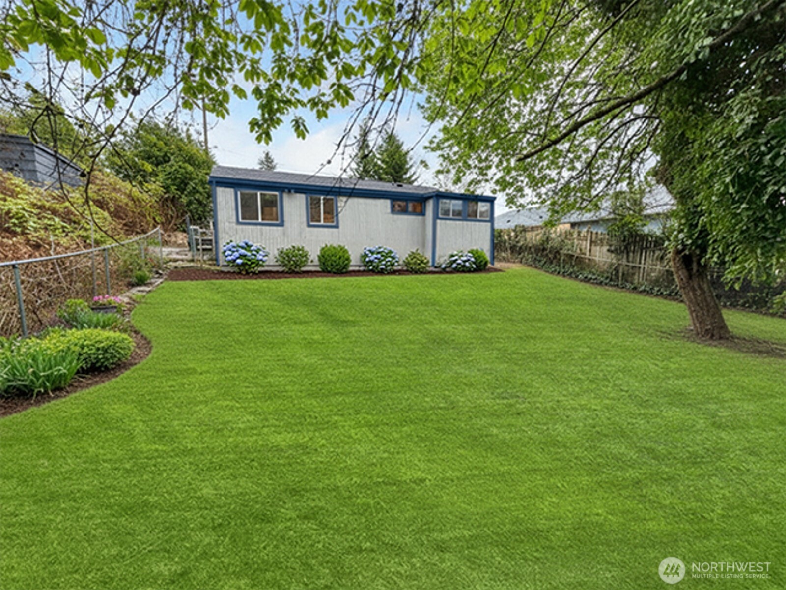8915 10th Avenue South Seattle, WA 98108 - Photo 20 of 23 a front view of a house with a yard and green space