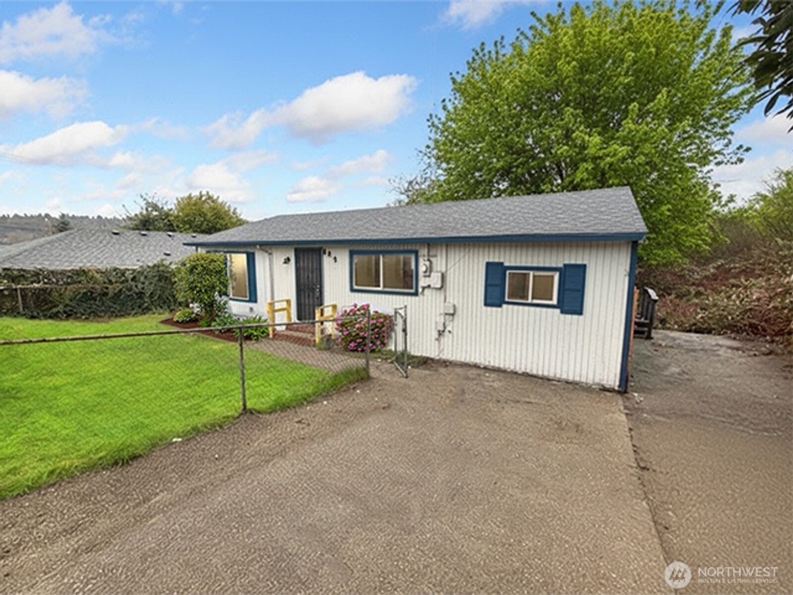 8915 10th Avenue South Seattle, WA 98108 - Photo 23 of 23 a view of a house with backyard and a tree