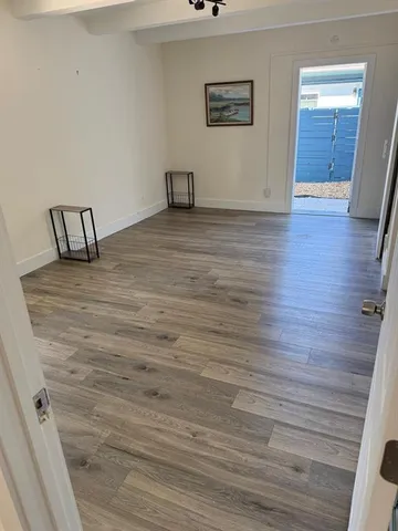 a view of a livingroom with wooden floor