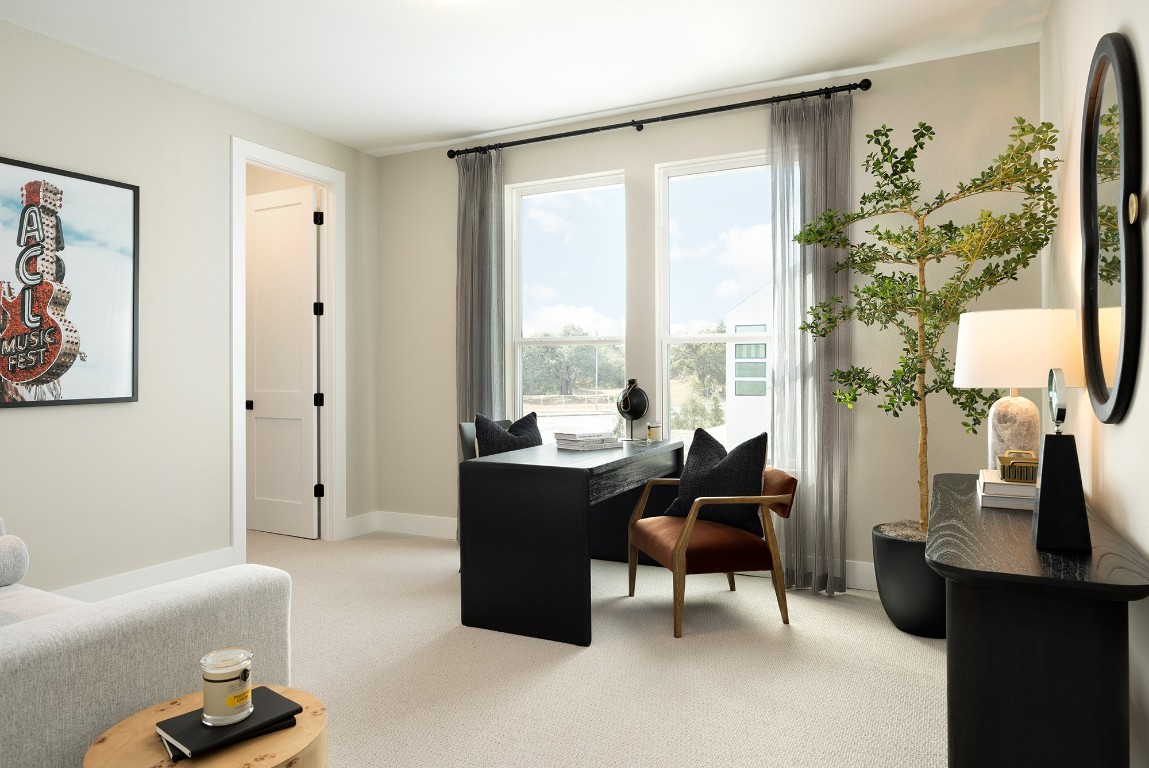 1407 Rambling Rose Road Austin, TX 78745 - Photo 11 of 12 a living room with furniture and a large window