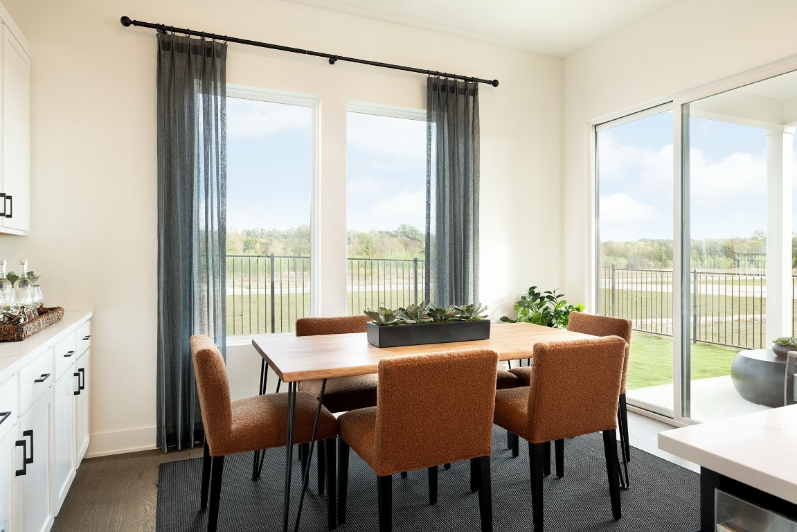 1407 Rambling Rose Road Austin, TX 78745 - Photo 4 of 12 a view of a dining room with furniture window and outside view
