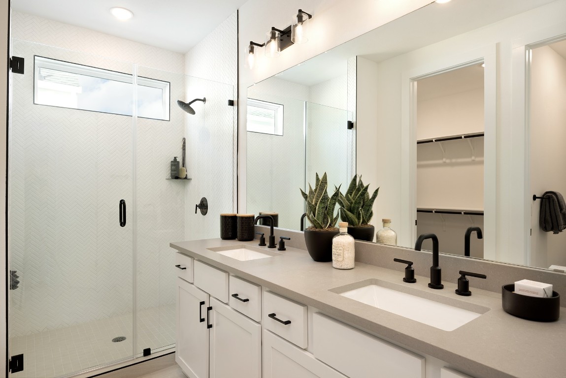 1407 Rambling Rose Road Austin, TX 78745 - Photo 6 of 12 a bathroom with double sink and a mirror