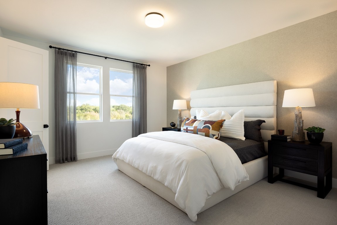 1407 Rambling Rose Road Austin, TX 78745 - Photo 7 of 12 a bedroom with a bed and a window