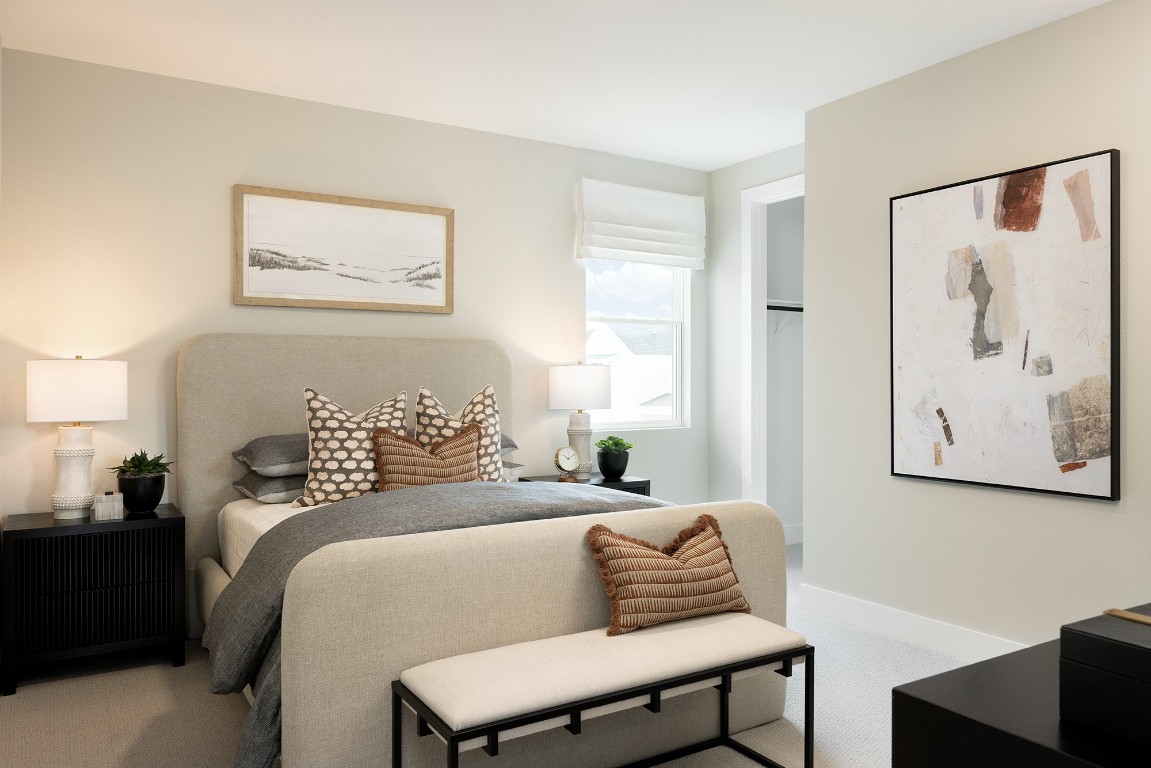 1407 Rambling Rose Road Austin, TX 78745 - Photo 8 of 12 a bedroom with a bed and wooden floor