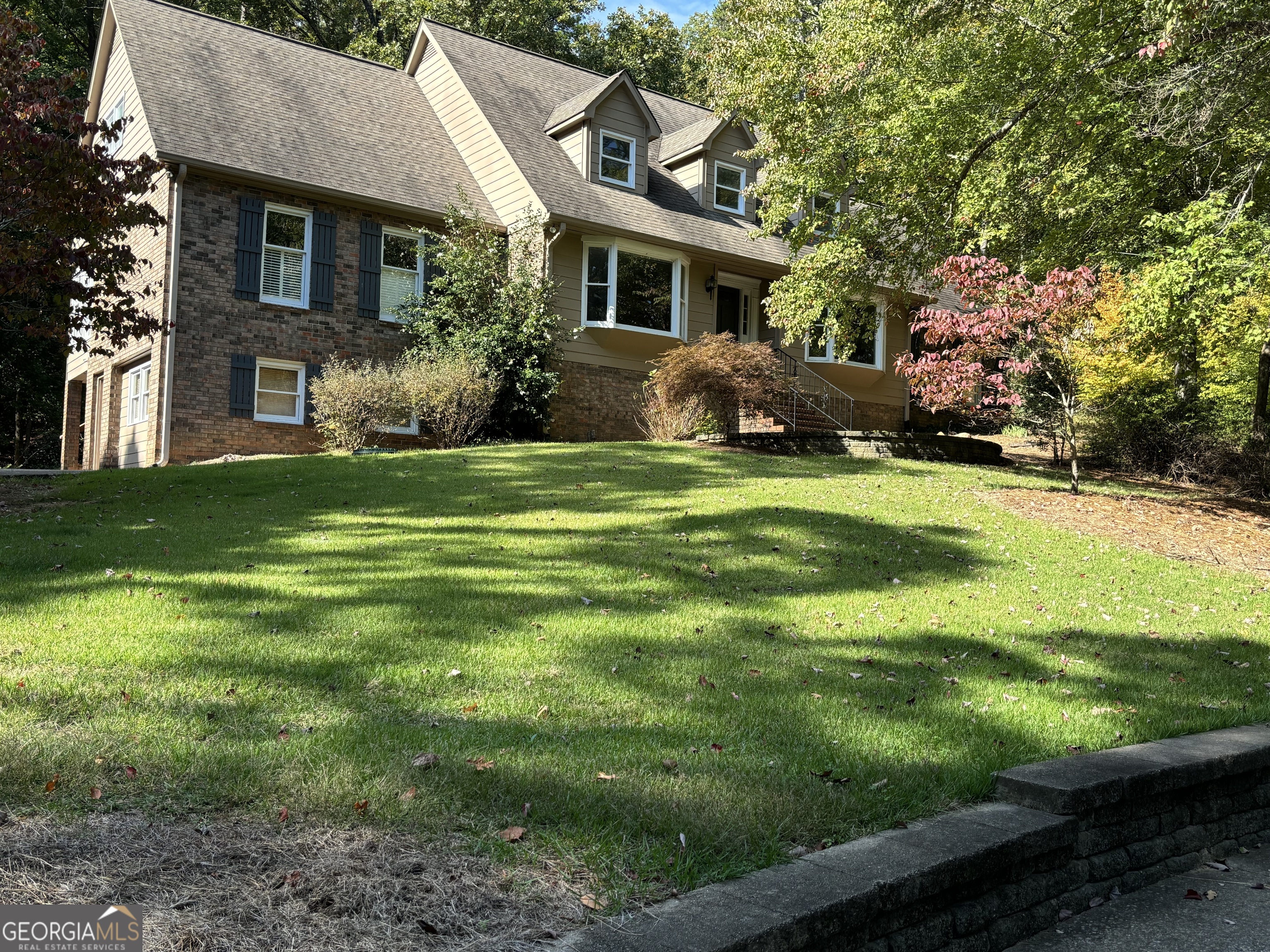 153 Fairview Road Southwest Rome, GA 30165 - Photo 1 of 1 a front view of house with yard and green space