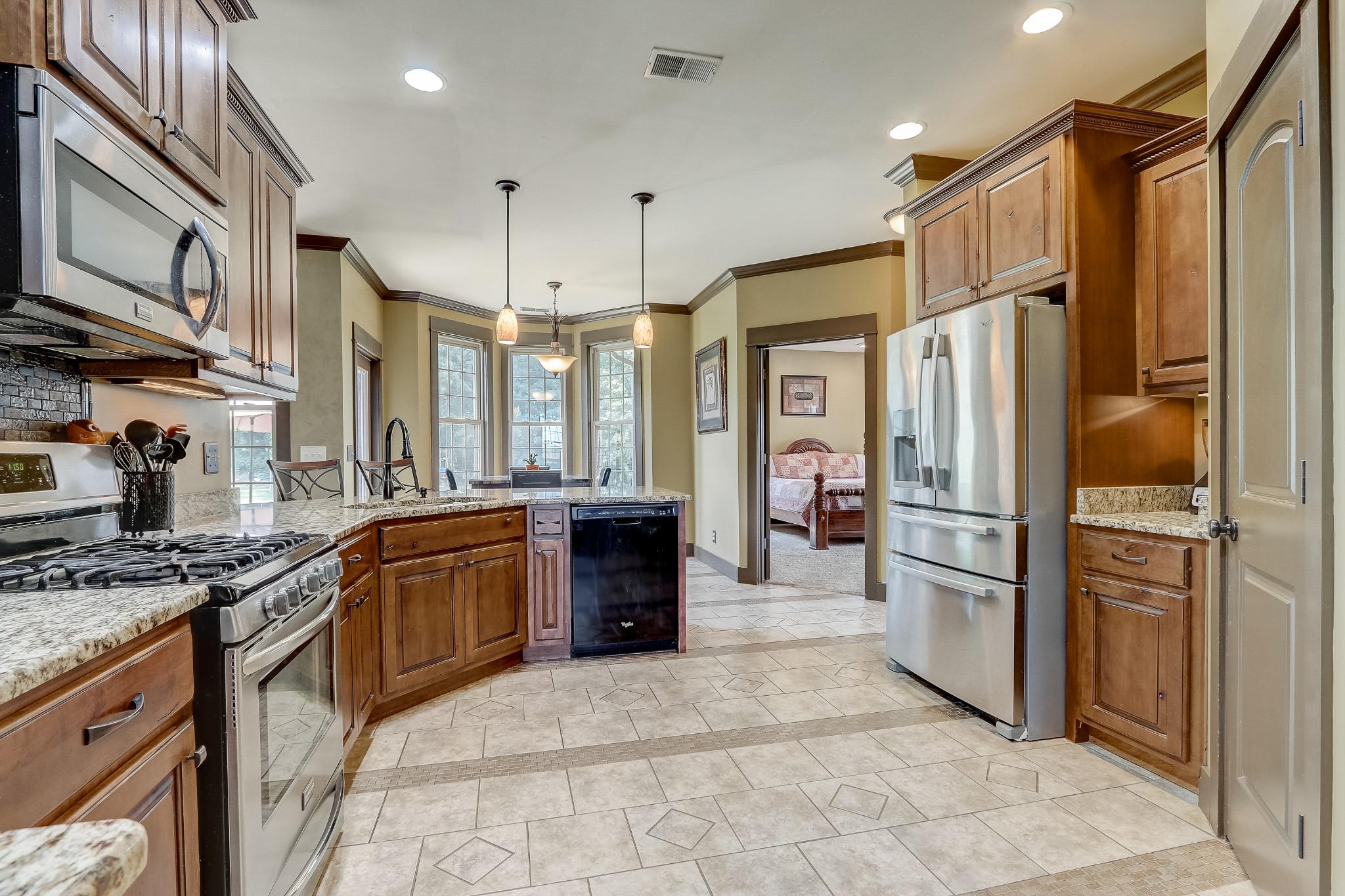 6745 Lovel Cook Road Springfield, TN 37172 - Photo 11 of 45 a kitchen with stainless steel appliances granite countertop a refrigerator and a sink