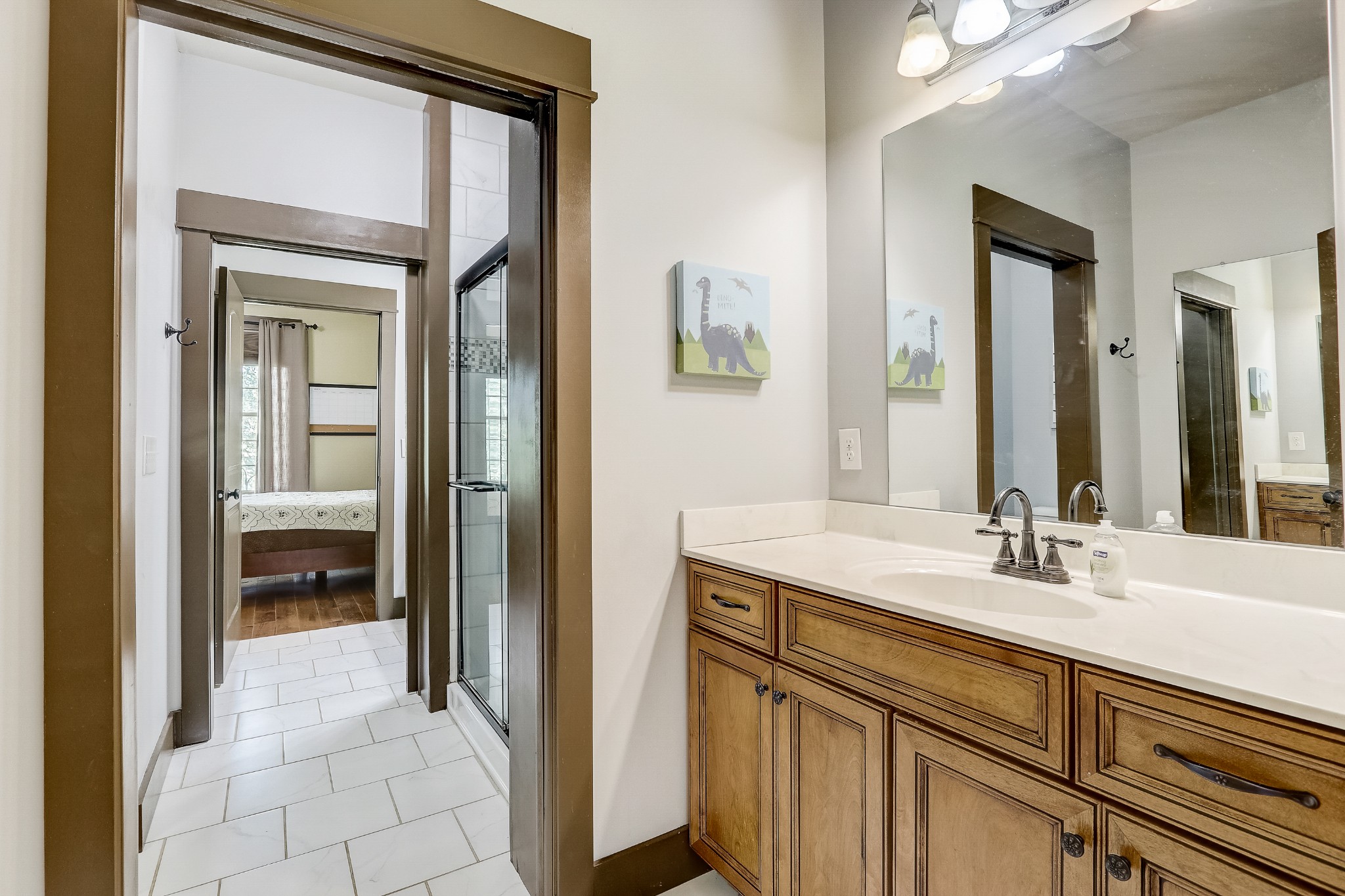 6745 Lovel Cook Road Springfield, TN 37172 - Photo 16 of 45 a en suite bathroom with a sink a mirror and a shower