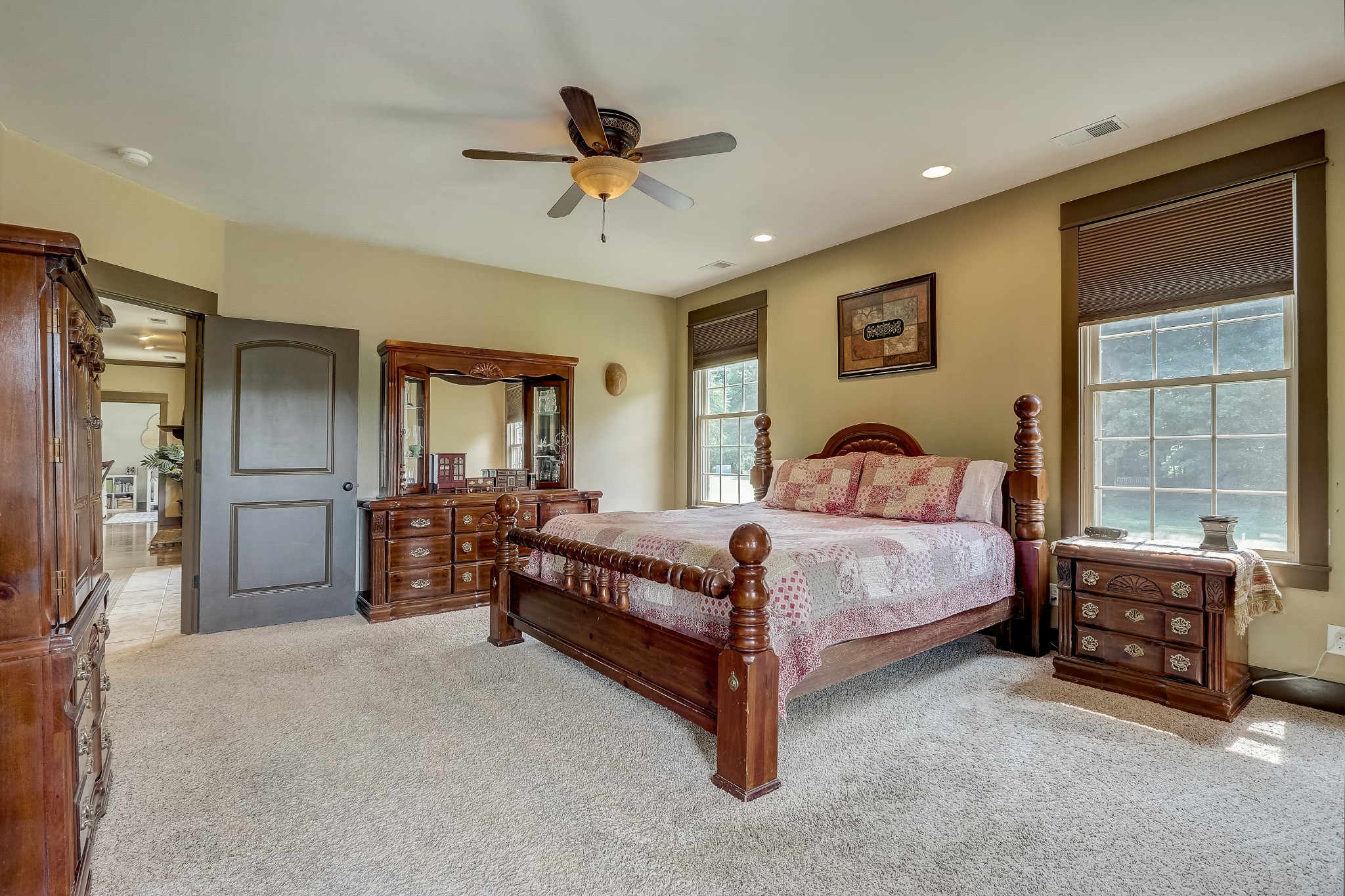 6745 Lovel Cook Road Springfield, TN 37172 - Photo 26 of 45 a bedroom with a bed and a chandelier