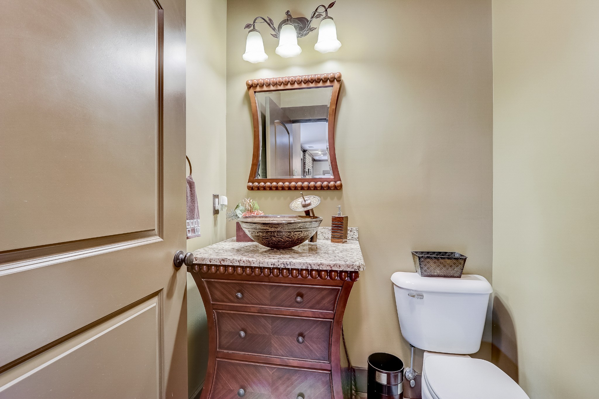 6745 Lovel Cook Road Springfield, TN 37172 - Photo 30 of 45 a bathroom with a toilet a sink and mirror