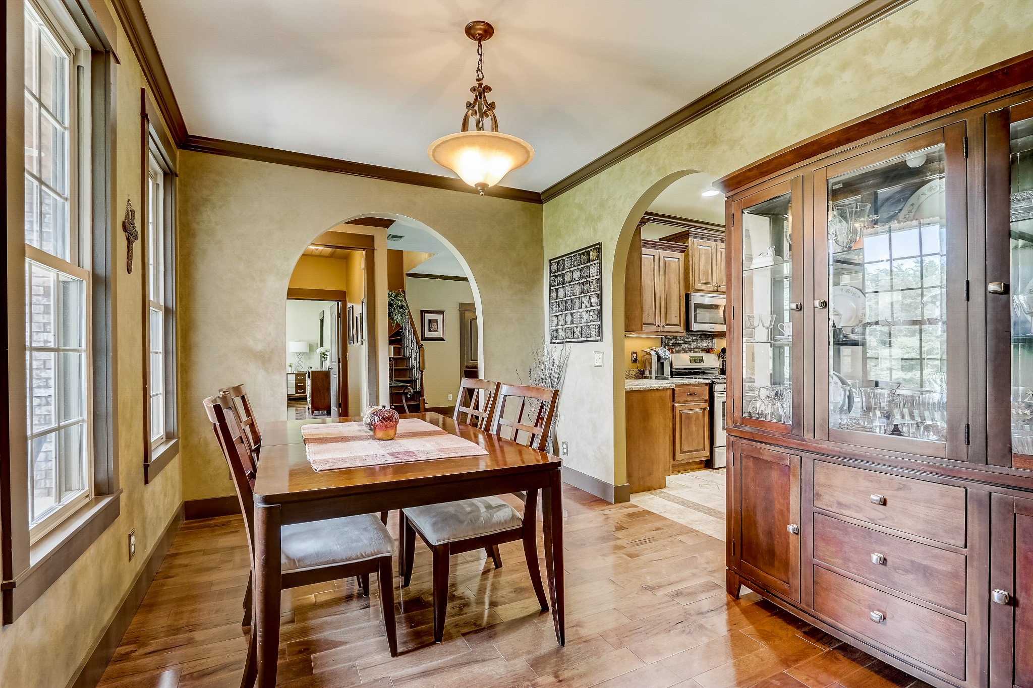 6745 Lovel Cook Road Springfield, TN 37172 - Photo 7 of 45 a dining room with furniture a chandelier and wooden floor