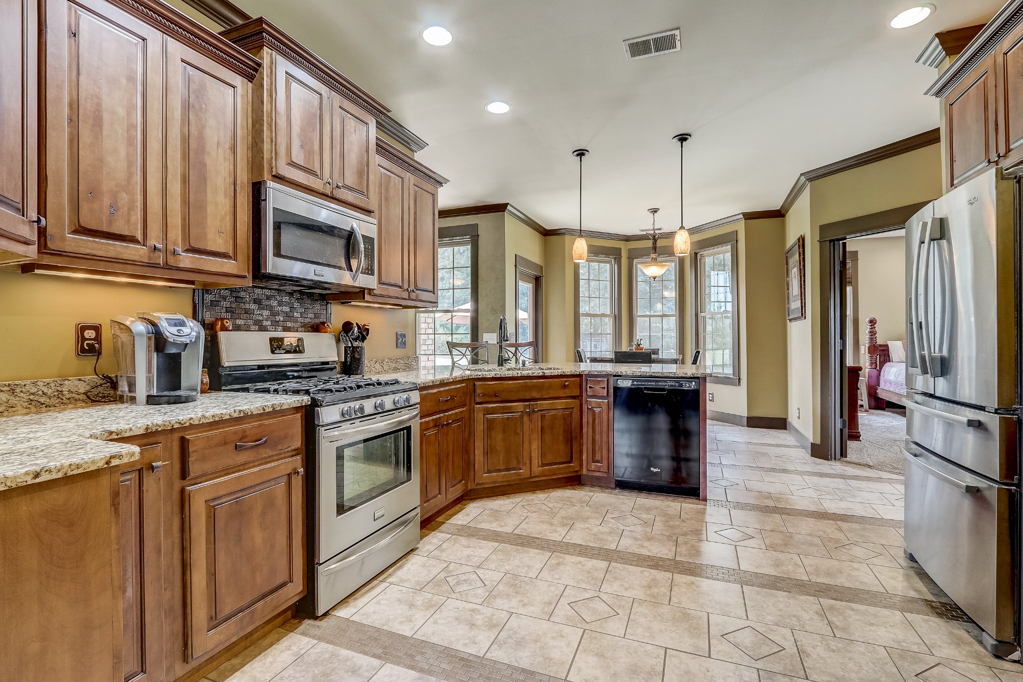 6745 Lovel Cook Road Springfield, TN 37172 - Photo 10 of 45 a kitchen with stainless steel appliances granite countertop a stove top oven a sink dishwasher a refrigerator and a cabinets