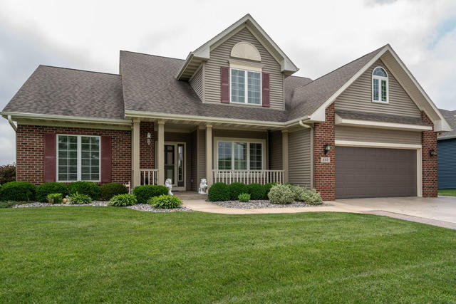 460 Boulder Ridge Drive Lake Geneva, WI 53147 - Photo 1 of 1 a front view of a house with garden