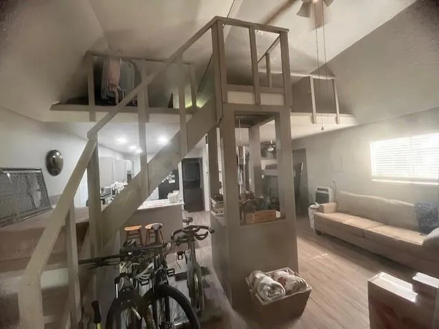 a front view of a house with yard and tree s