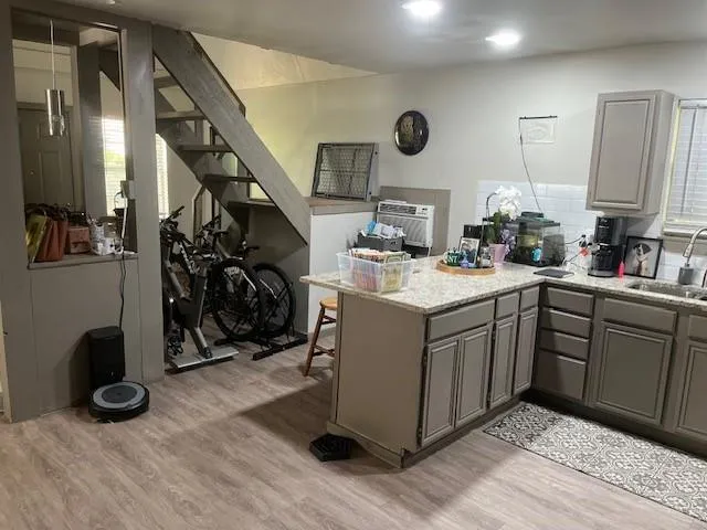 a kitchen with a sink a stove and cabinets