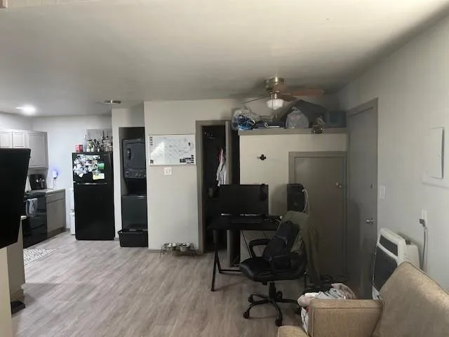 a workspace with furniture and wooden floor