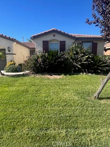 a view of a house with a garden