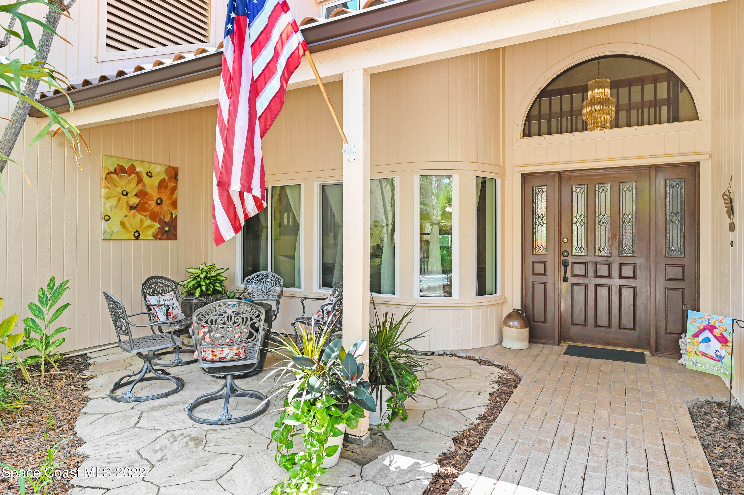 a front view of a house with patio