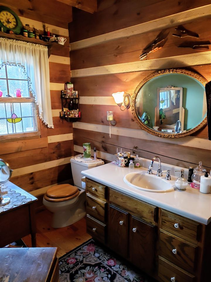 539 Purple Cow Road Waynesboro, VA 22980 - Photo 13 of 25 a bathroom with a sink and a mirror