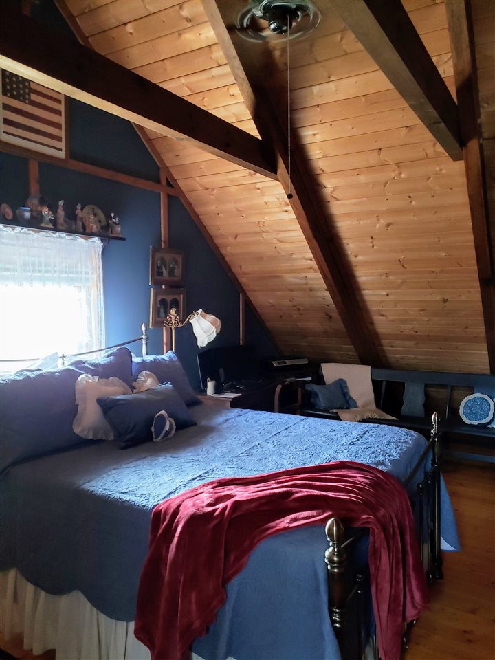 539 Purple Cow Road Waynesboro, VA 22980 - Photo 18 of 25 a bedroom with furniture and a mirror