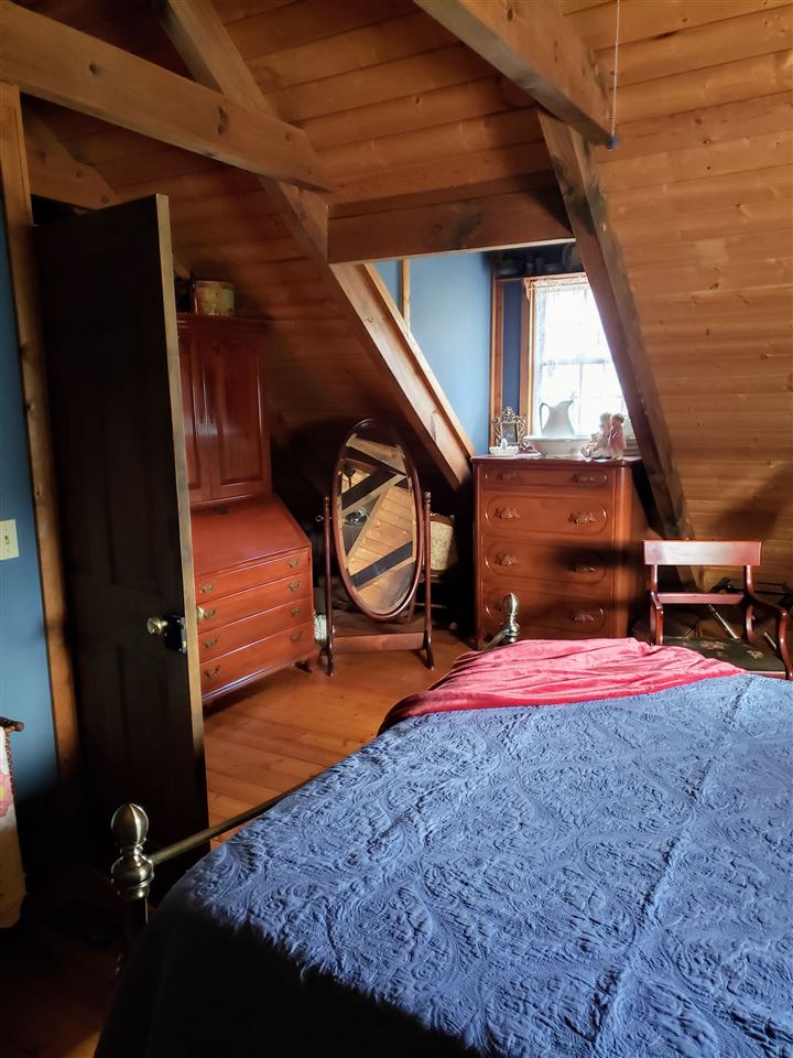 539 Purple Cow Road Waynesboro, VA 22980 - Photo 19 of 25 a bedroom with a bed and a mirror