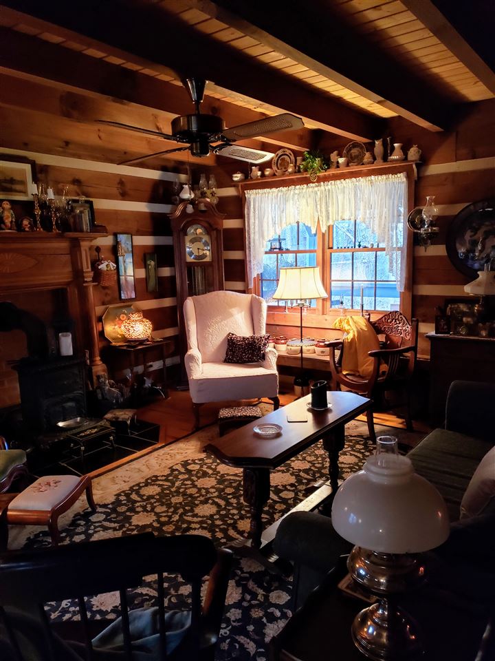 539 Purple Cow Road Waynesboro, VA 22980 - Photo 5 of 25 a living room with lots of furniture and a fireplace