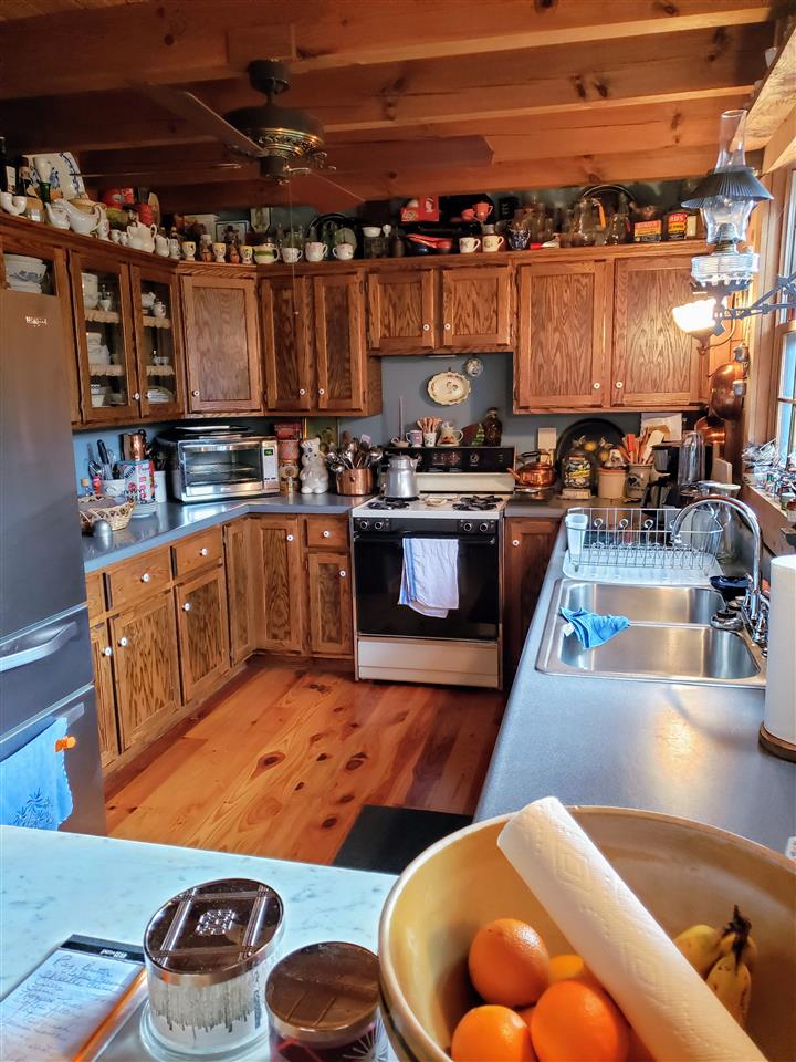 539 Purple Cow Road Waynesboro, VA 22980 - Photo 8 of 25 a kitchen with stainless steel appliances granite countertop a sink a stove and a wooden cabinets
