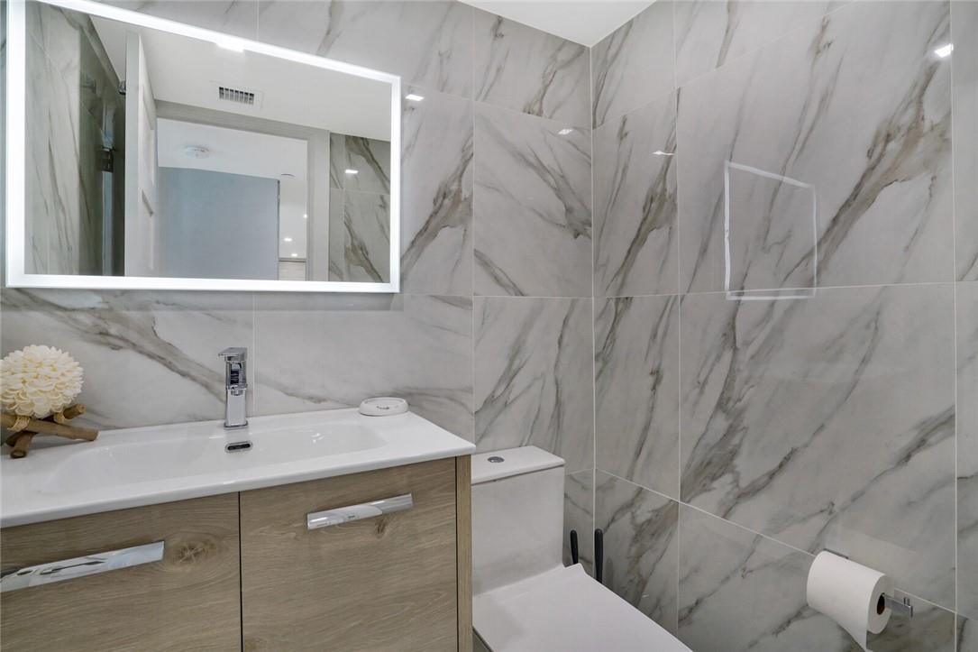 77 South Birch Road, Unit 3B Fort Lauderdale, FL 33316 - Photo 19 of 39 guest half bath