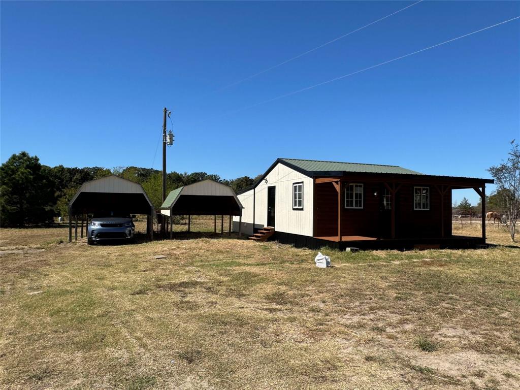 184 County Road Pattonville, TX 75468 - Photo 17 of 20 a view of a house with a yard