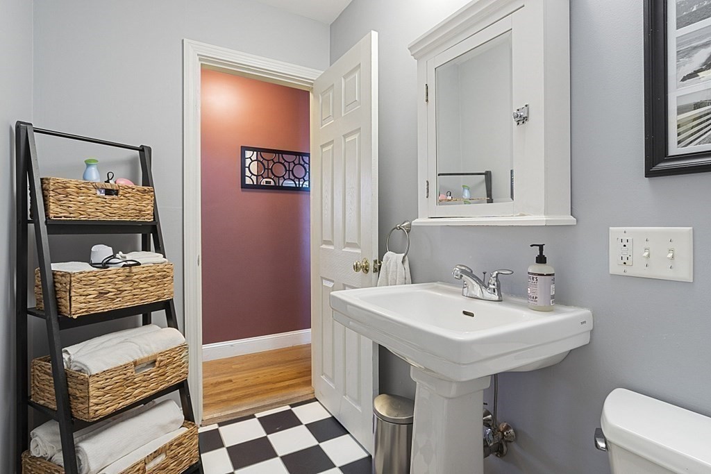 29 Ocean Avenue, Unit 4 Salem, MA 01970 - Photo 16 of 32 a bathroom with a sink and a mirror
