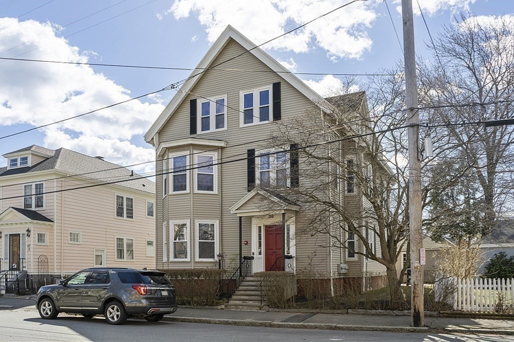 29 Ocean Avenue, Unit 4 Salem, MA 01970 - Photo 2 of 32 a car parked in front of a white house