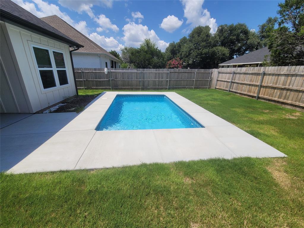 4825 Wichita Street Granbury, TX 76048 - Photo 29 of 30 a view of a backyard with swimming pool