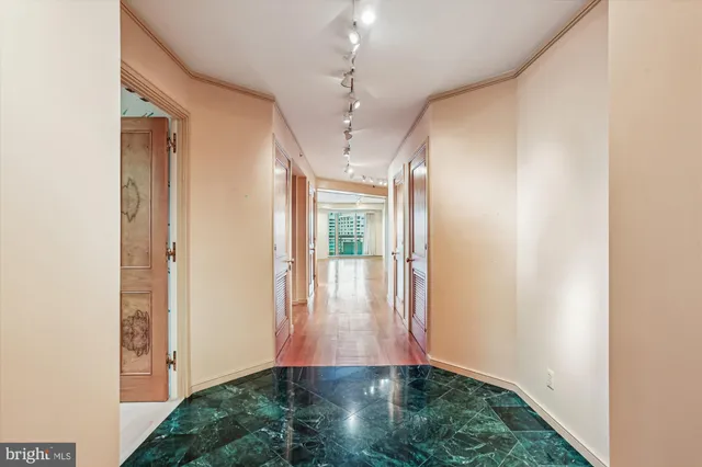 a view of gallery with wooden floor