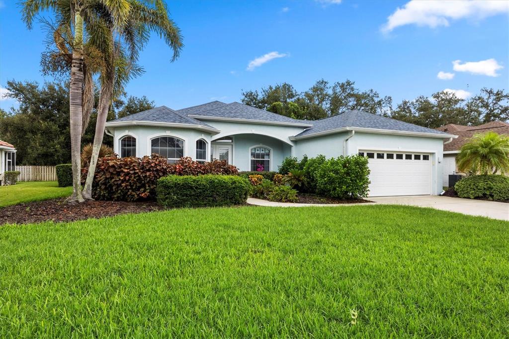 160 Wading Bird Drive Venice, FL 34292 - Photo 1 of 47 a front view of a house with a garden