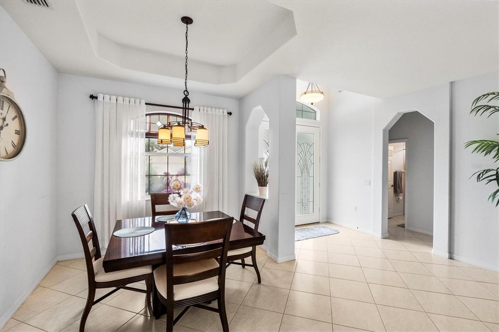 160 Wading Bird Drive Venice, FL 34292 - Photo 11 of 47 a dining room with furniture and window
