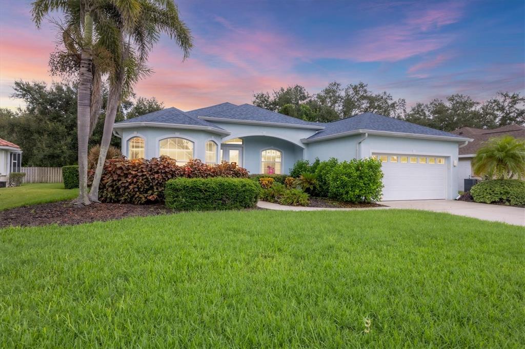 160 Wading Bird Drive Venice, FL 34292 - Photo 2 of 47 a front view of a house with a garden