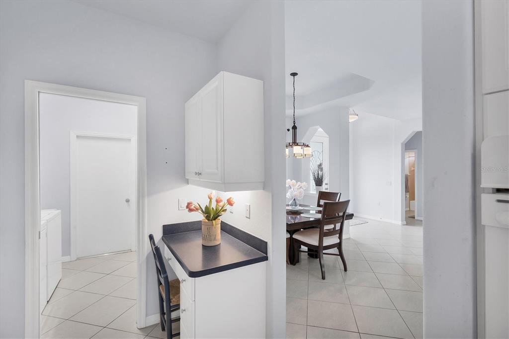 160 Wading Bird Drive Venice, FL 34292 - Photo 22 of 47 a room with a table chairs and a refrigerator