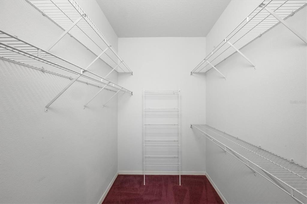 160 Wading Bird Drive Venice, FL 34292 - Photo 33 of 47 a view of walk in closet with empty racks
