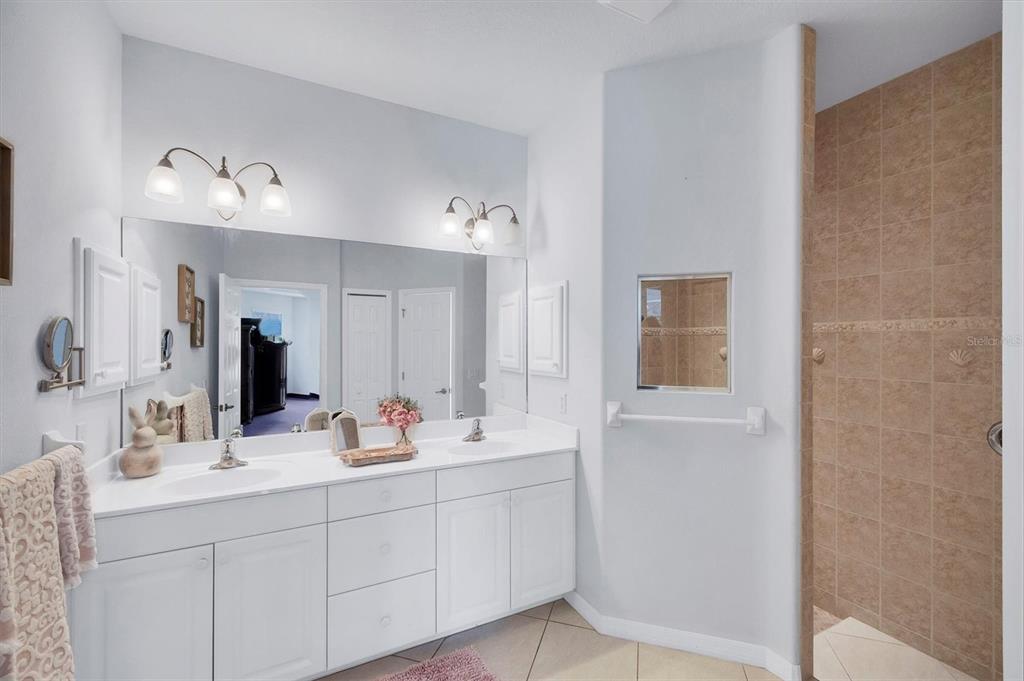 160 Wading Bird Drive Venice, FL 34292 - Photo 34 of 47 a bathroom with a double vanity sink mirror and double