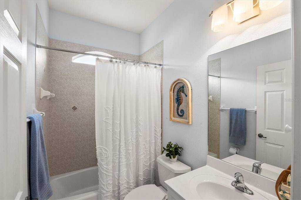 160 Wading Bird Drive Venice, FL 34292 - Photo 39 of 47 a bathroom with a granite countertop sink toilet and shower