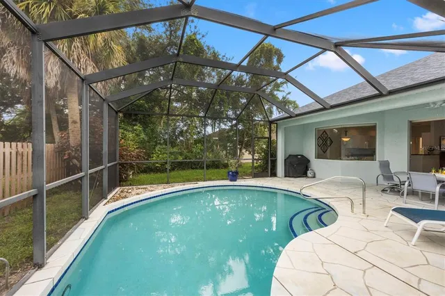 a view of a swimming pool with a patio