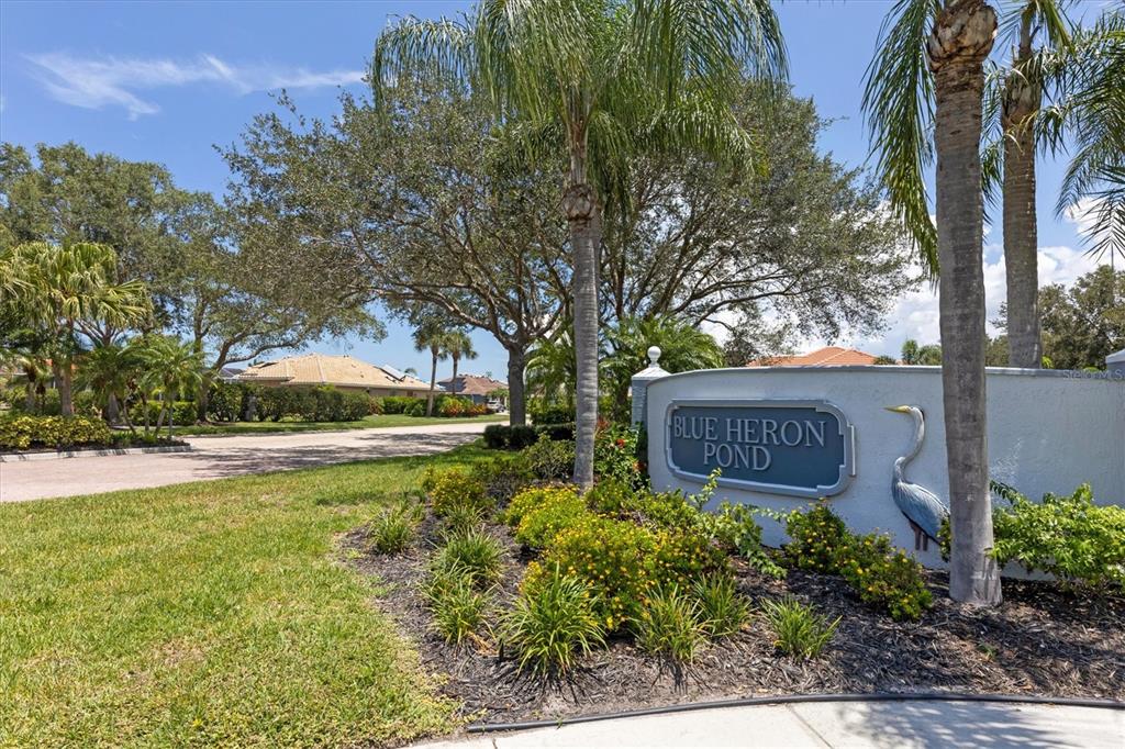 160 Wading Bird Drive Venice, FL 34292 - Photo 47 of 47 a sign that is sitting in front of a tree