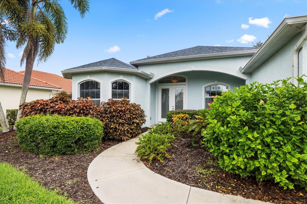 160 Wading Bird Drive Venice, FL 34292 - Photo 6 of 47 a front view of a house with a garden