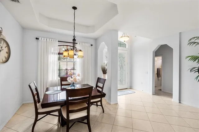 a dining room with furniture and window