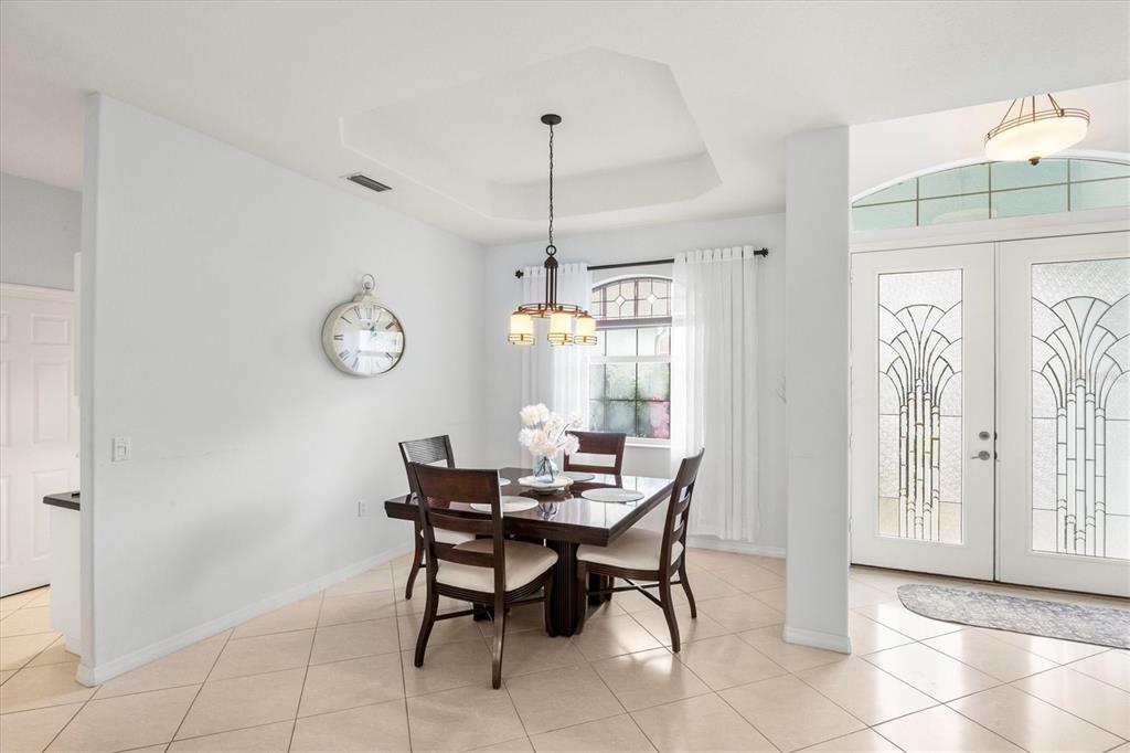 160 Wading Bird Drive Venice, FL 34292 - Photo 10 of 47 a dining room with furniture and window