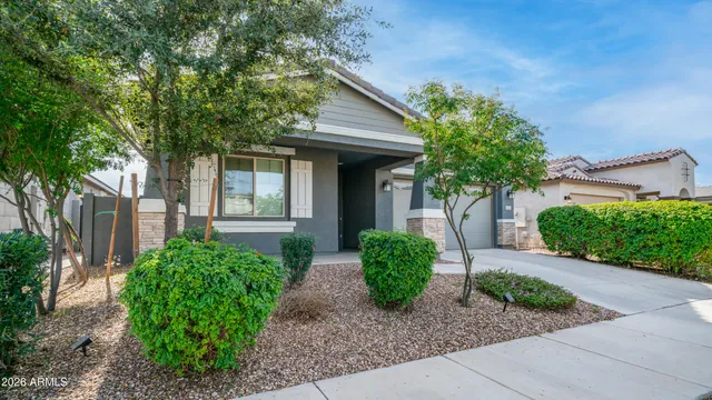 a front view of a house with garden