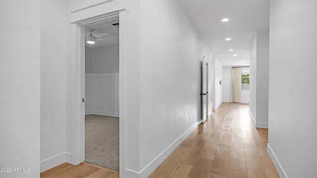 a view of hallway with wooden floor