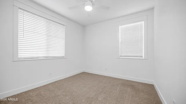 a view of a kitchen with a refrigerator and a sink