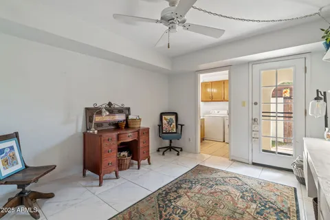 a view of a workspace with furniture and a bedroom