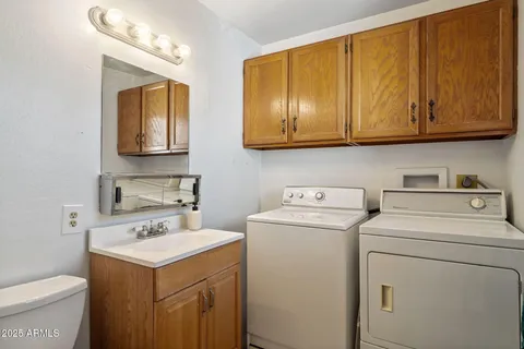 a utility room with dryer and washer