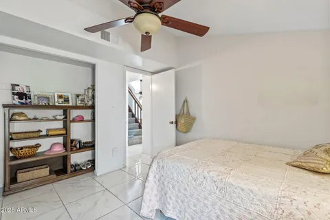 a bedroom with a bed and cabinets